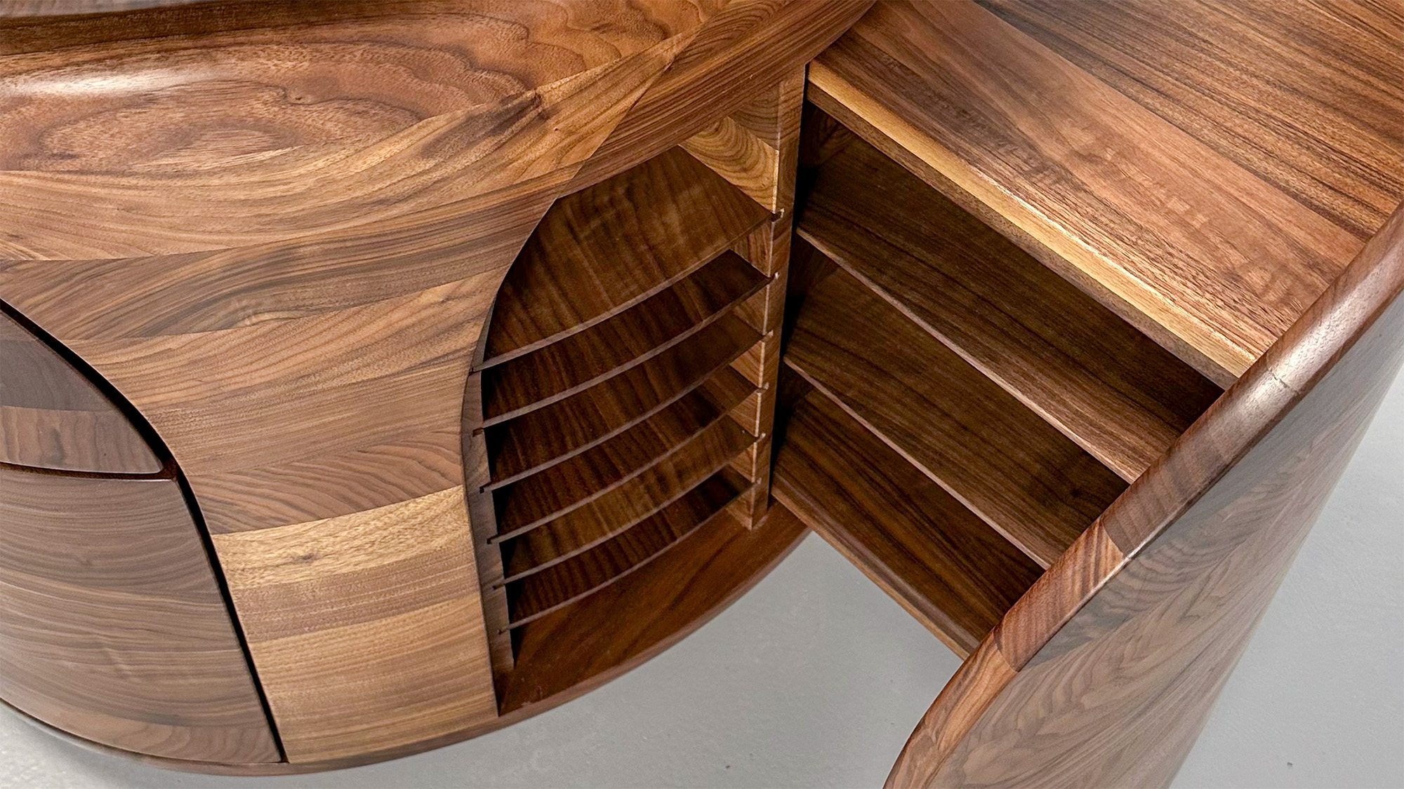 Fibonacci Wave — leather writing surface inset into walnut